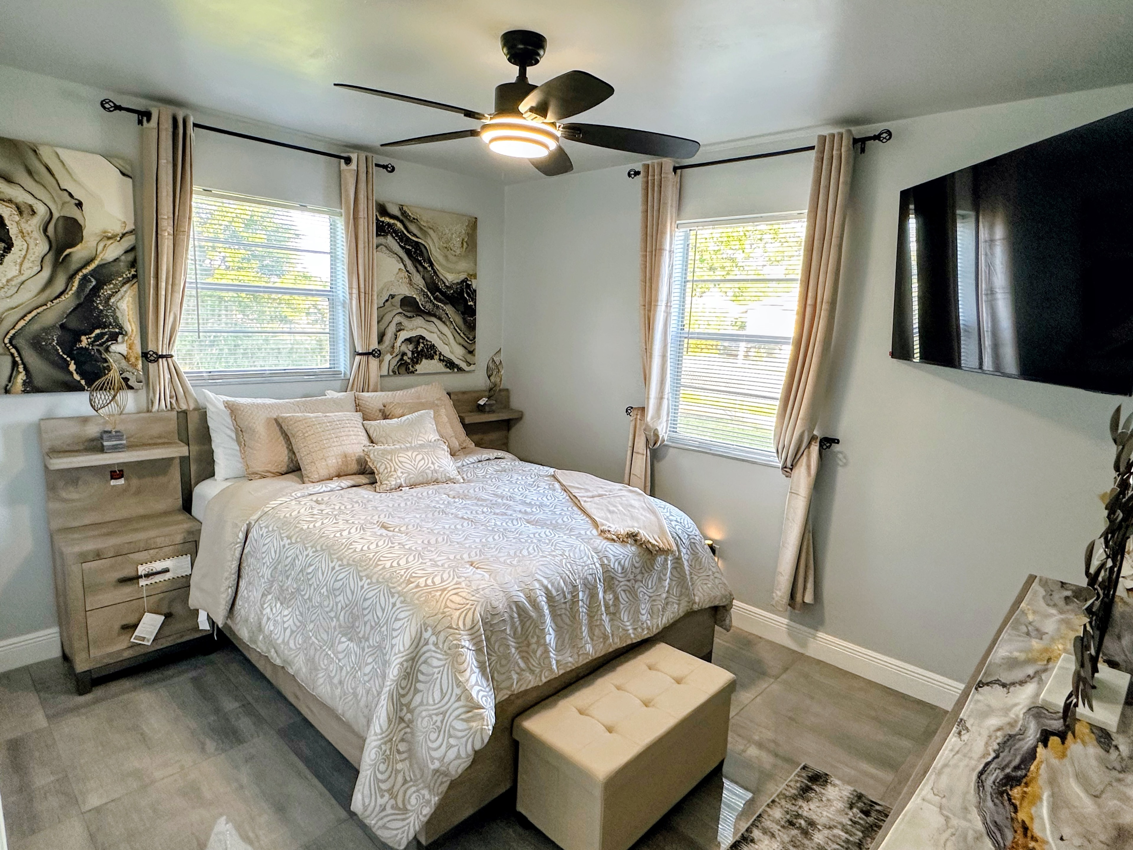 Bedroom 1 — neutral tones with ceiling fan